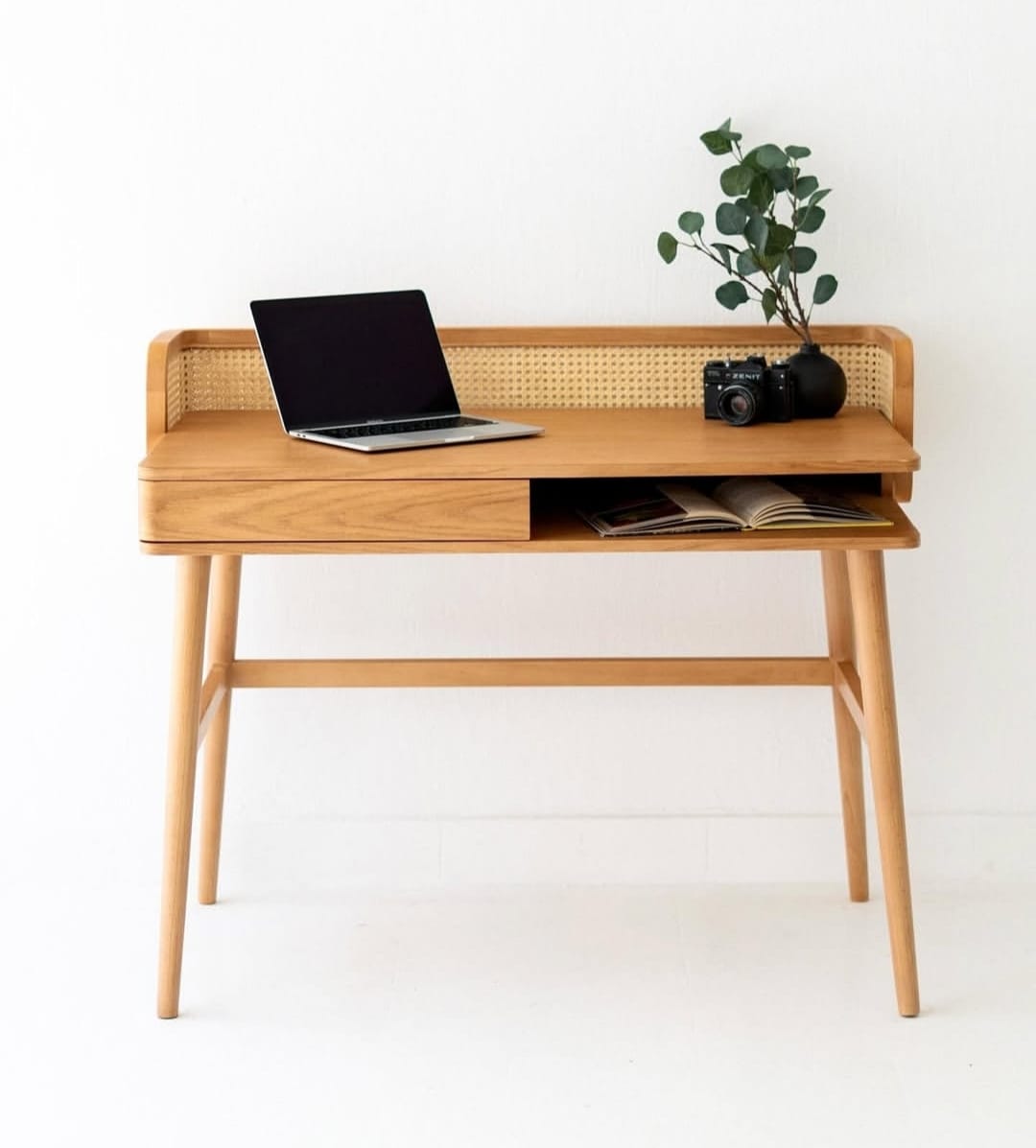 Side angle of Canelin table highlighting solid wood frame