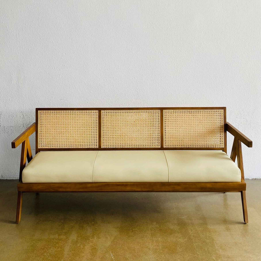 Side angle of Hand Weave Rest bench highlighting wood frame