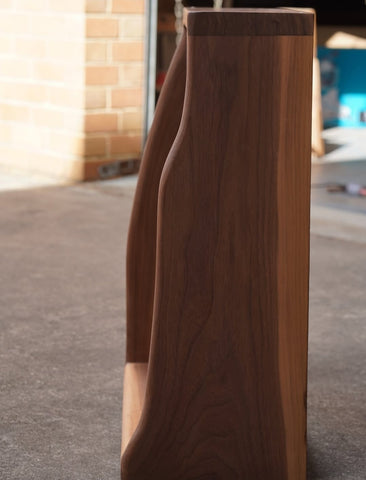 "Solid wood side table beside sofa setting"