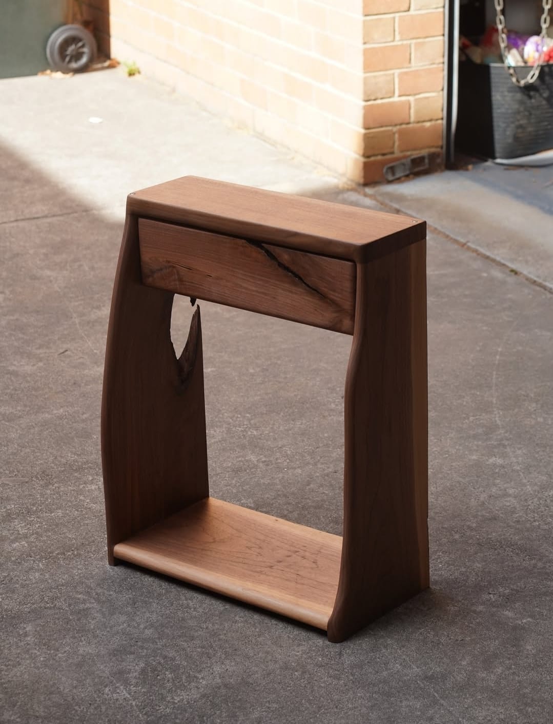 "Solid wood side table with glossy finish"