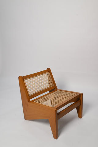"Virsa rattan lounge chair styled in a living room setting"