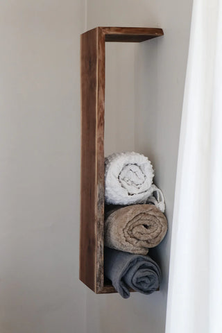 Waterfall wood shelf mounted on wall, front view