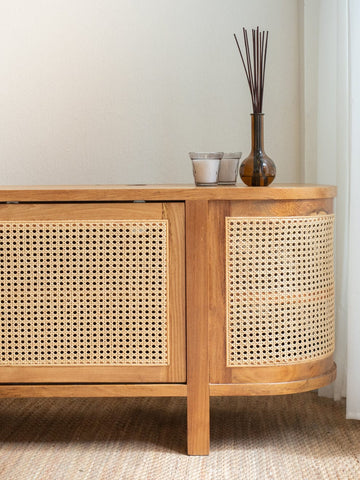 Wooden TV console with hand-woven cane panels