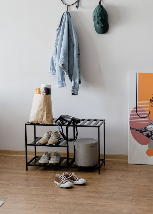 open-shelf metal shoe organizer in hallway