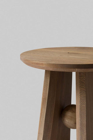 wooden stool cushioned top close-up